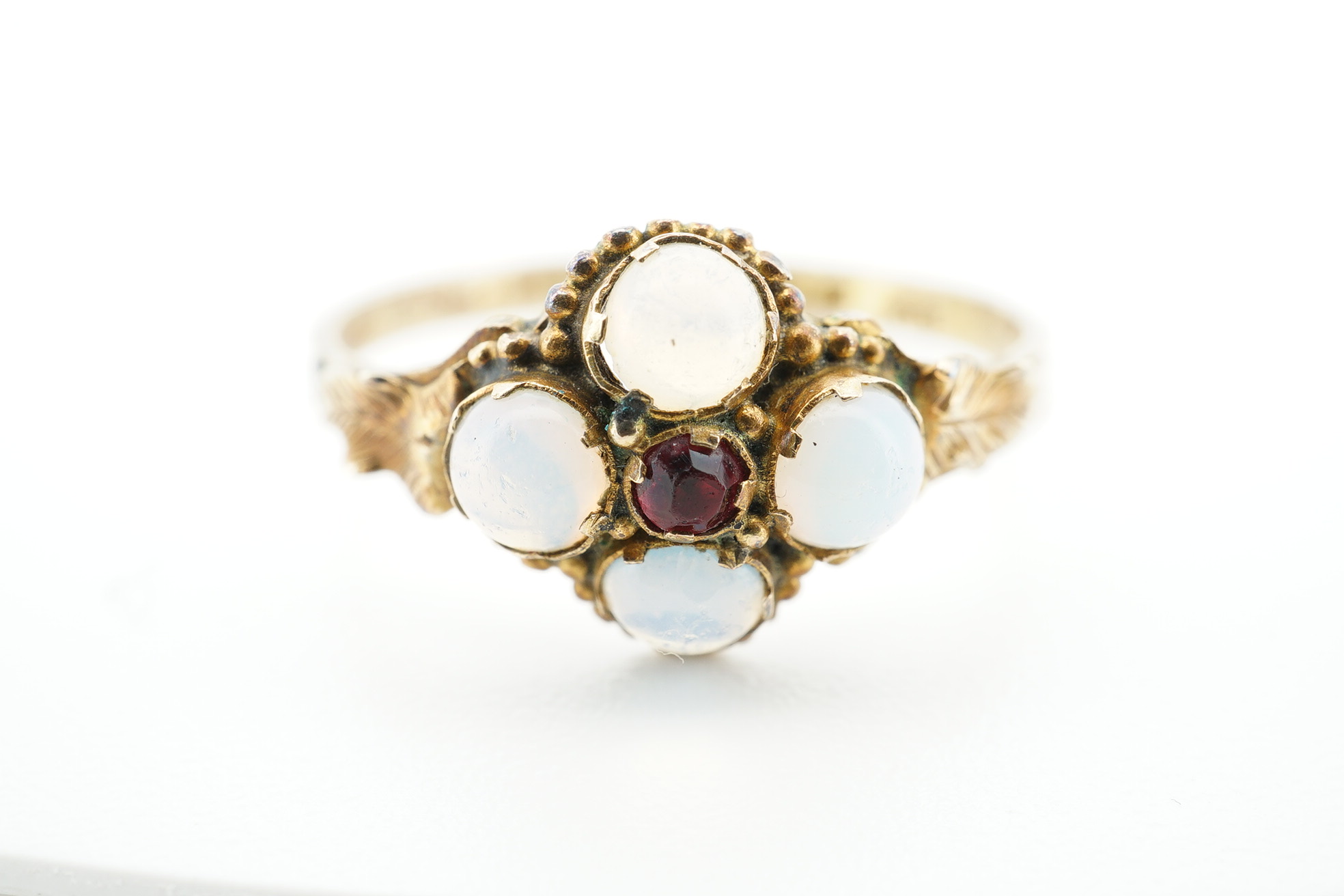 An early 20th century 9ct gold and opal cluster cluster set ring, size M, a 9ct and four(ex five) stone set opal half hoop ring and an 18ct and five stone diamond set half hoop ring. Condition - poor to fair